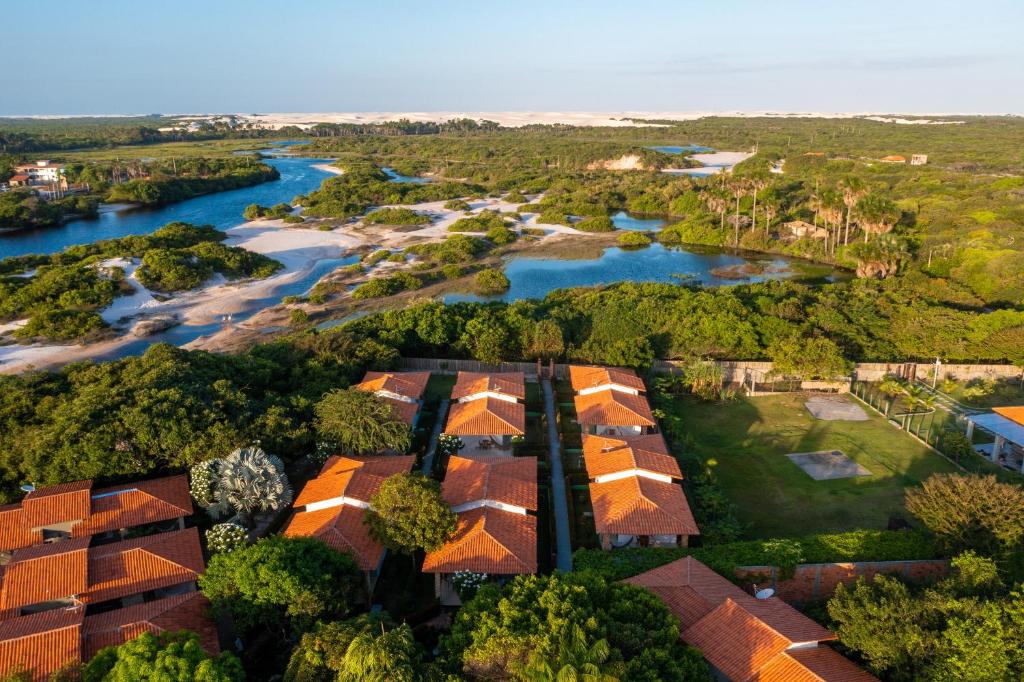 an aerial view of a house with a river at Pousada Rancho das Dunas in Santo Amaro