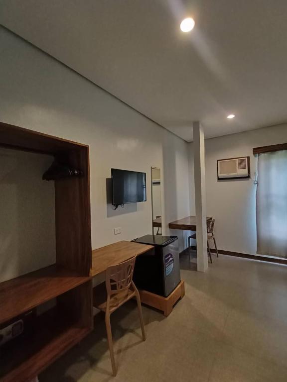 TV a/nebo společenská místnost v ubytování Acacia Garden Inn and Suites