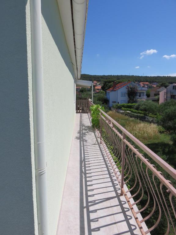 a view from a balcony of a building with a railing at Apartments with a parking space Bibinje, Zadar - 5753 in Bibinje