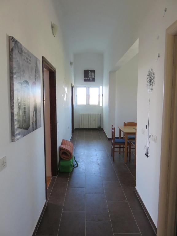 a room with a tile floor and a dining room at Apartments with a parking space Bibinje, Zadar - 5753 in Bibinje