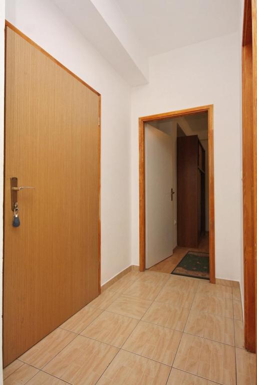an empty room with a door and a hallway at Apartments with a parking space Bibinje, Zadar - 5753 in Bibinje