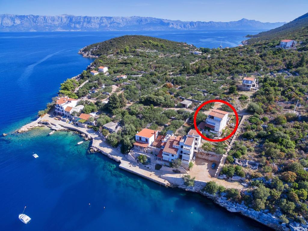 an aerial view of a house on an island in the water at Apartments by the sea Cove Pokrivenik, Hvar - 4604 in Gdinj