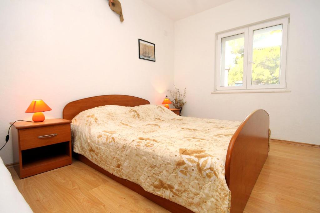 Postel nebo postele na pokoji v ubytování Apartments by the sea Lumbarda, Korcula - 4376