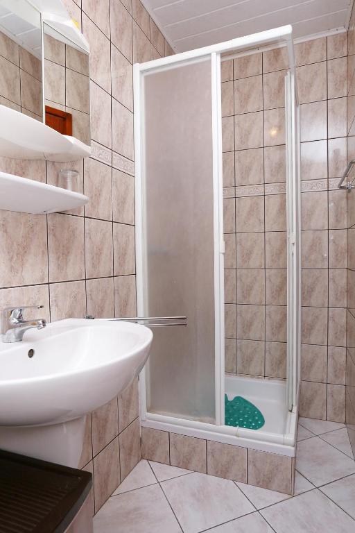 Kúpeľňa v ubytovaní Apartment Lumbarda 4442a