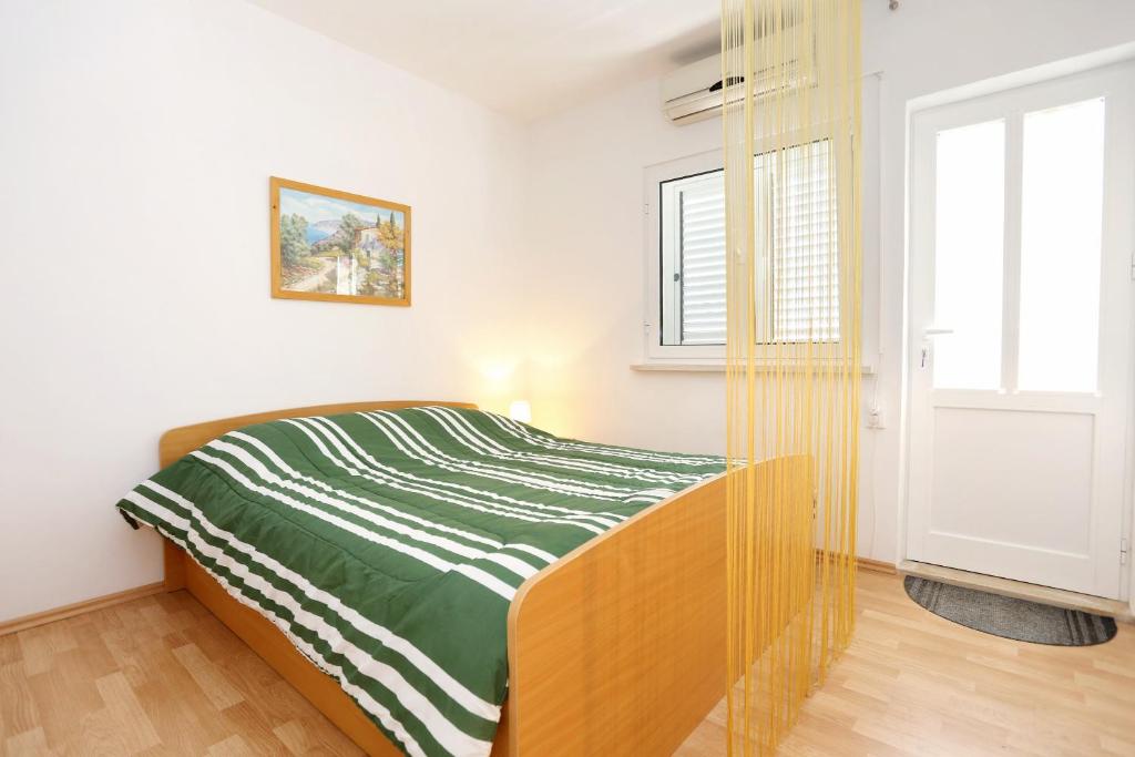 Postel nebo postele na pokoji v ubytování Apartments by the sea Lumbarda, Korcula - 4393