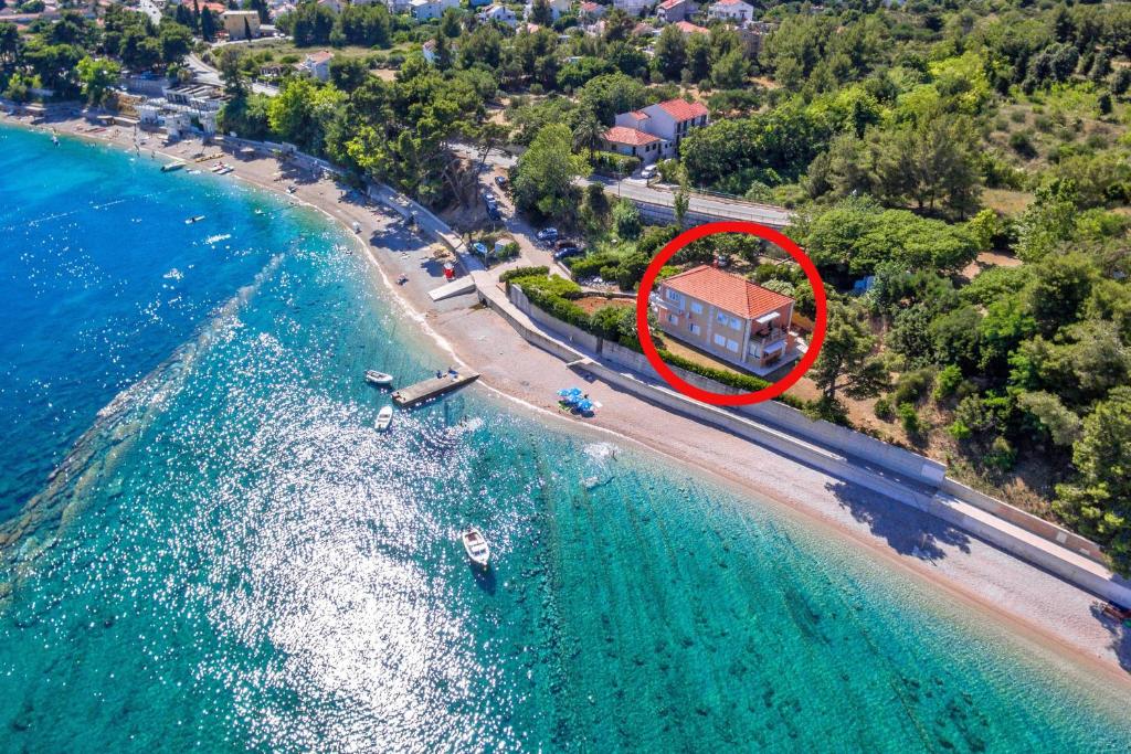 an aerial view of a house on a beach at Family friendly seaside apartments Orebic, Peljesac - 4537 in Orebić