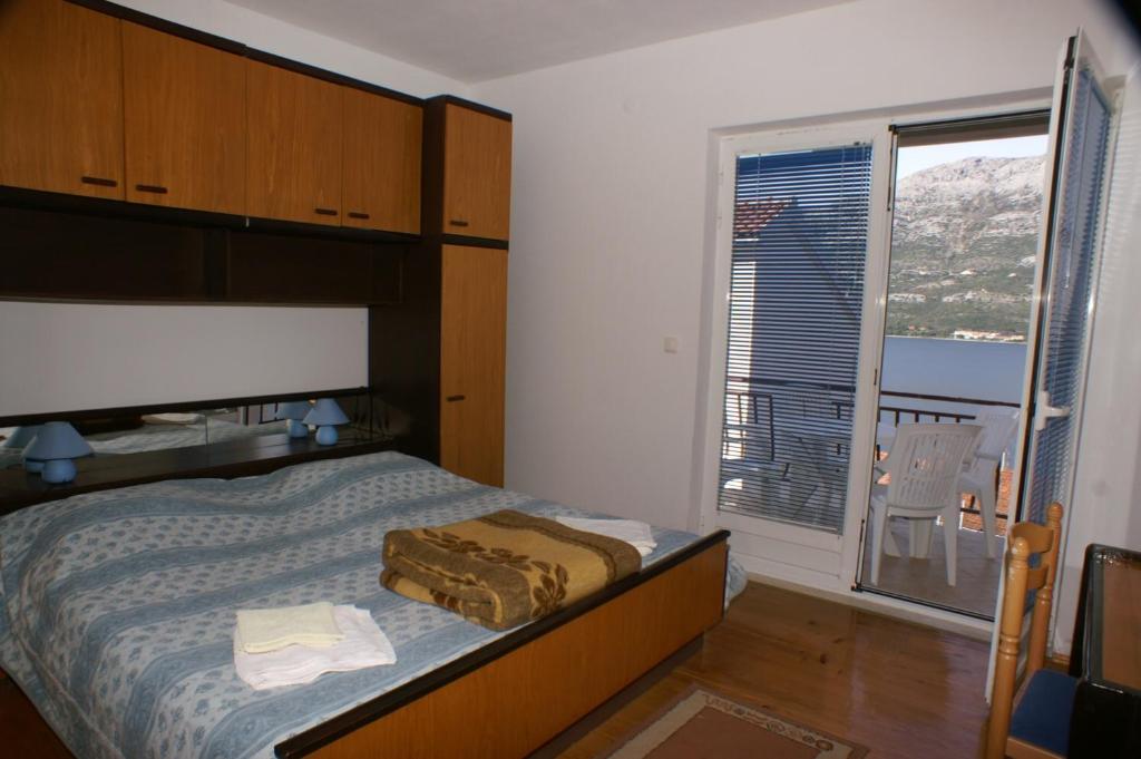 Posteľ alebo postele v izbe v ubytovaní Apartments by the sea Korcula - 4349