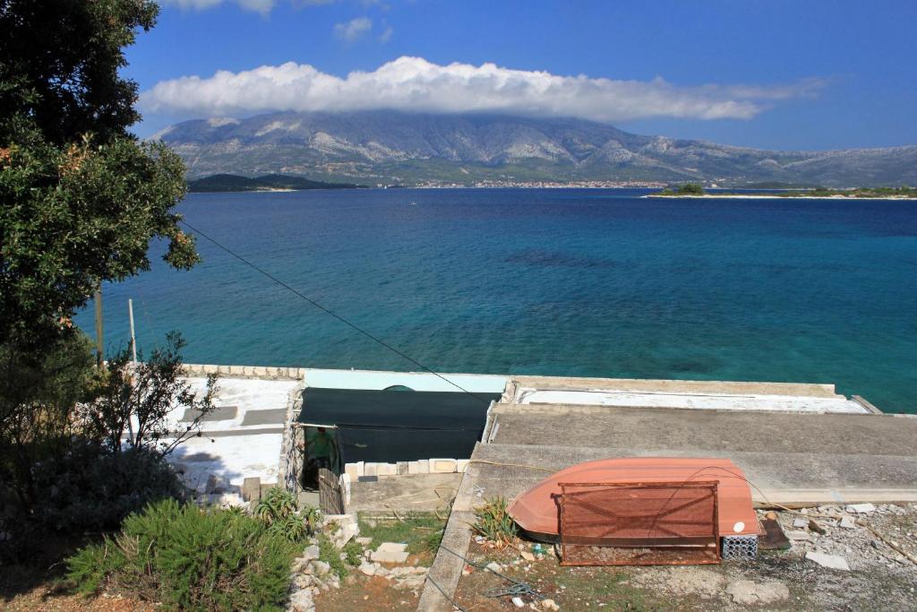 a view of a large body of water with a mountain at Seaside holiday house Lumbarda, Korcula - 4422 in Lumbarda