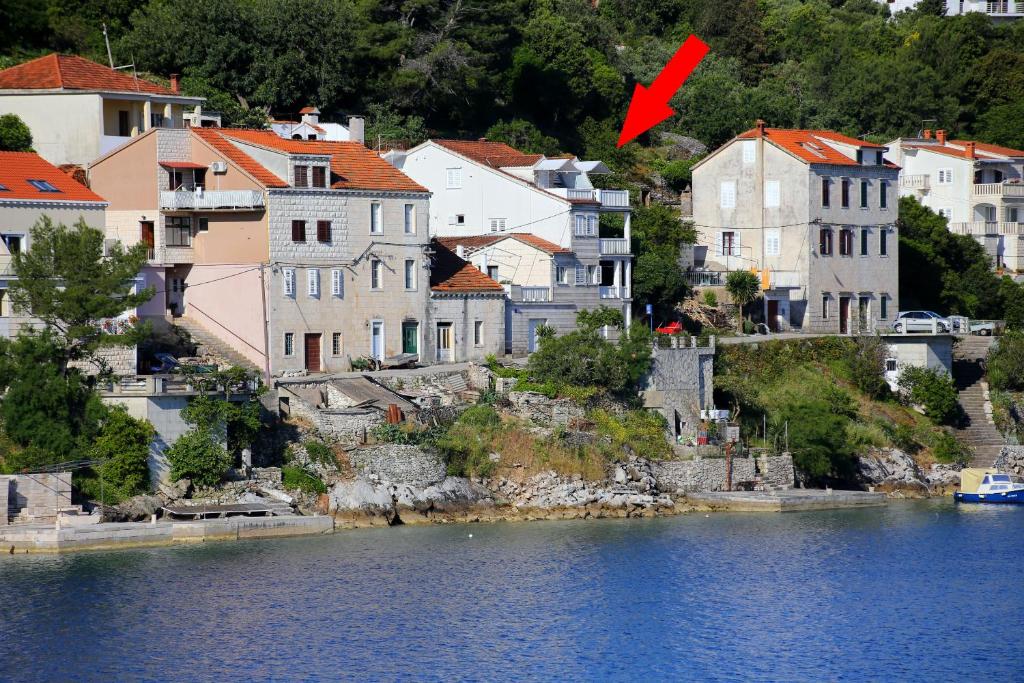 a town on the shore of a body of water at Apartment Racisce 4360a in Račišće