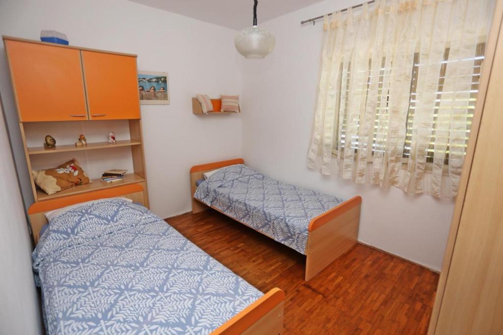 Postel nebo postele na pokoji v ubytování Apartments by the sea Lumbarda, Korcula - 4446