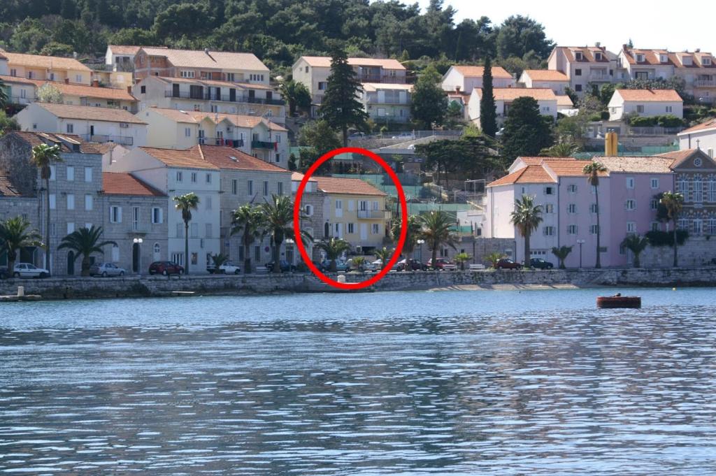 a red circle in the middle of a body of water at Double Room Korcula 4356c in Korčula