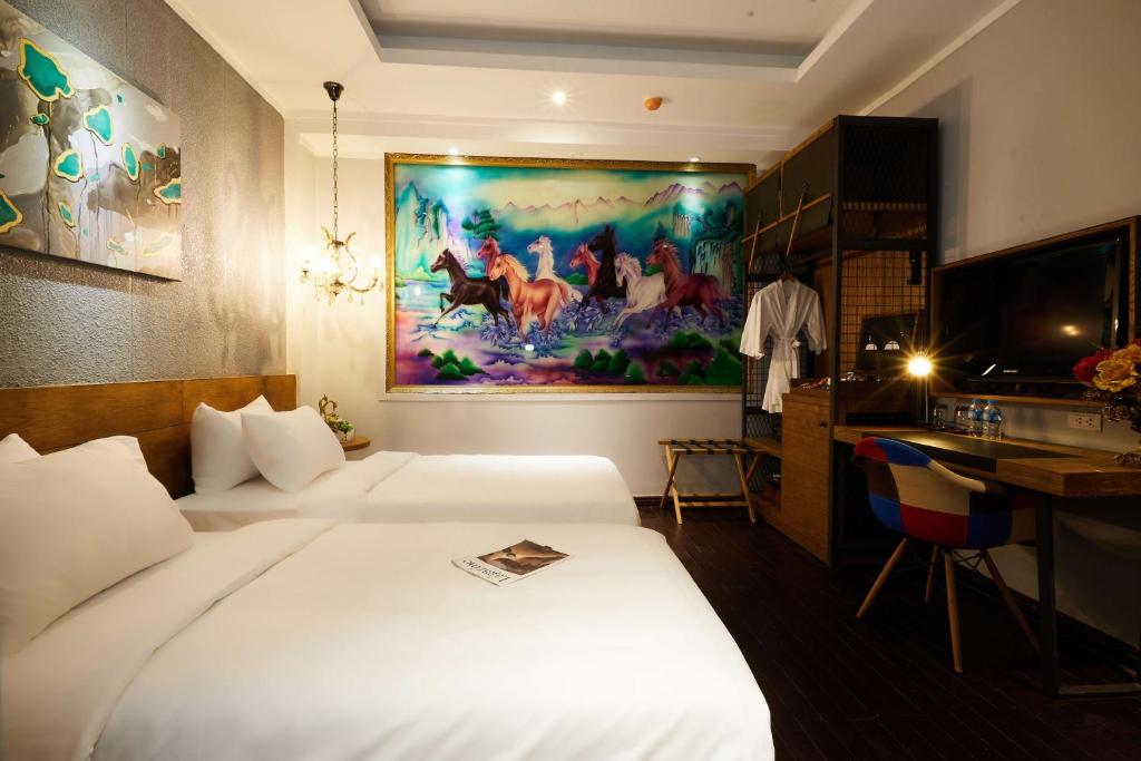Postel nebo postele na pokoji v ubytování HaNoi Calido Hotel