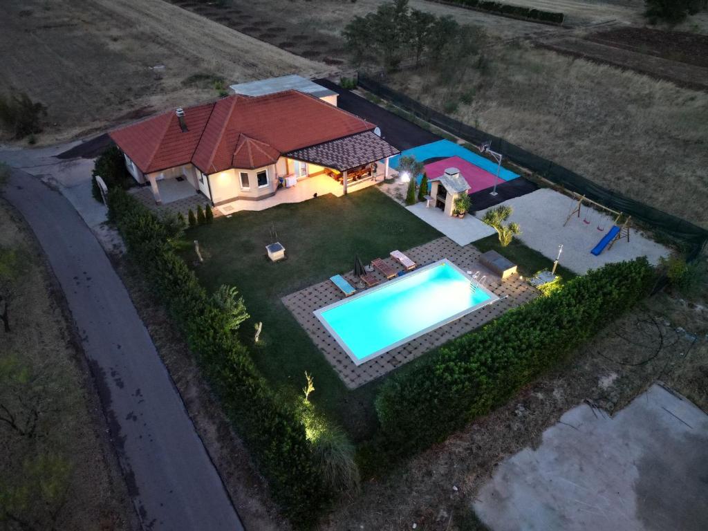 an overhead view of a house with a swimming pool at Villa six brothers in Juričići