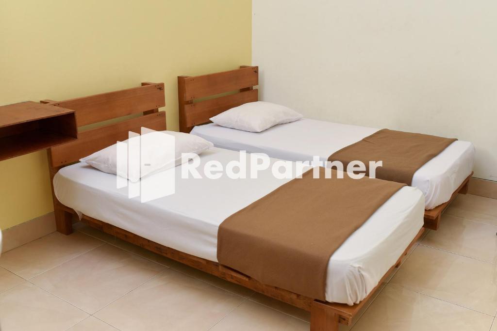 Homestay Rumah Citra Indah Syariah Mitra RedDoorz - Twin Room Met Gedeelde Badkamer