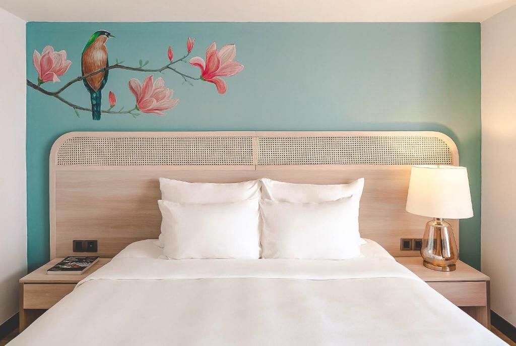 Postel nebo postele na pokoji v ubytování Hanoi Le Jardin Hotel & Spa