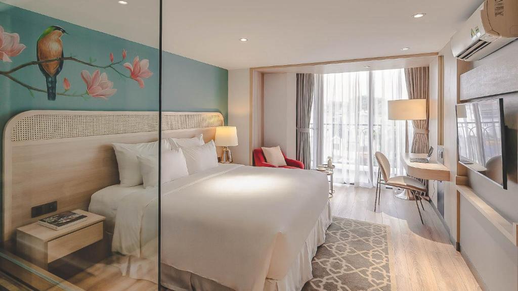 Postel nebo postele na pokoji v ubytování Hanoi Le Jardin Hotel & Spa