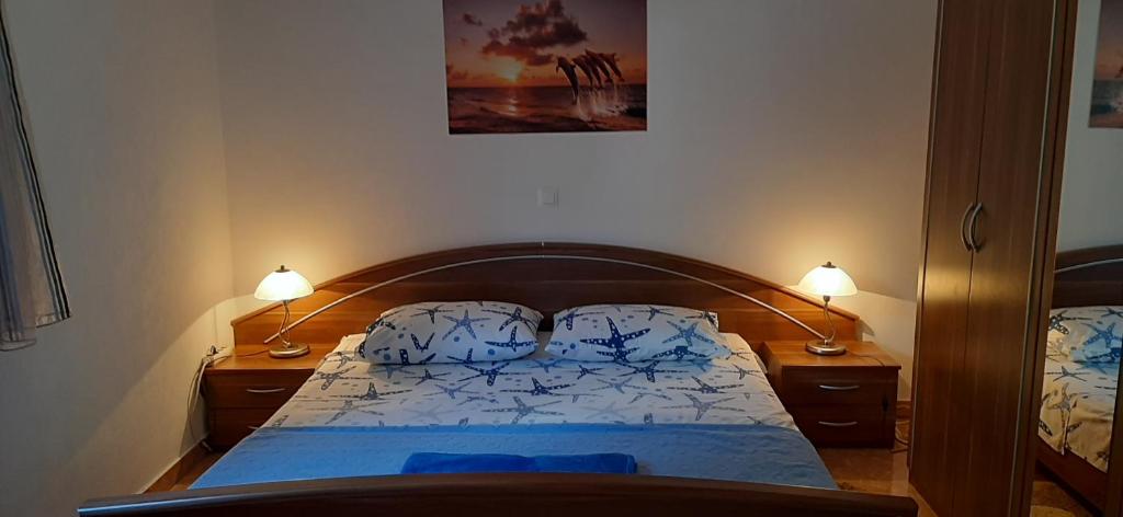 Łóżko lub łóżka w pokoju w obiekcie Apartment RB