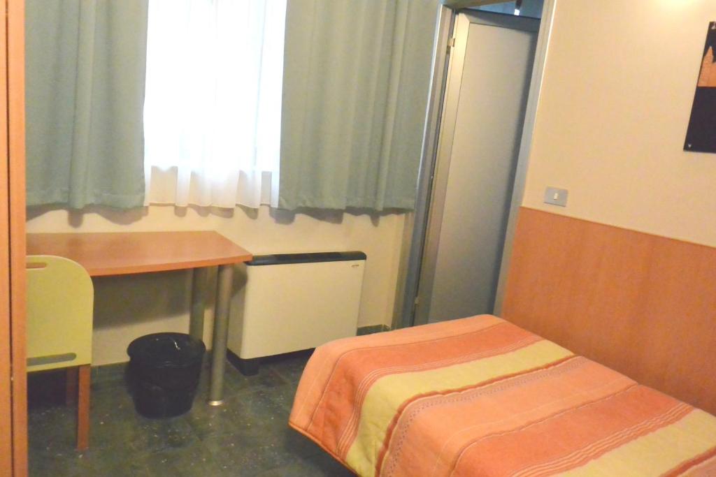 Postel nebo postele na pokoji v ubytování Hotel Balbo