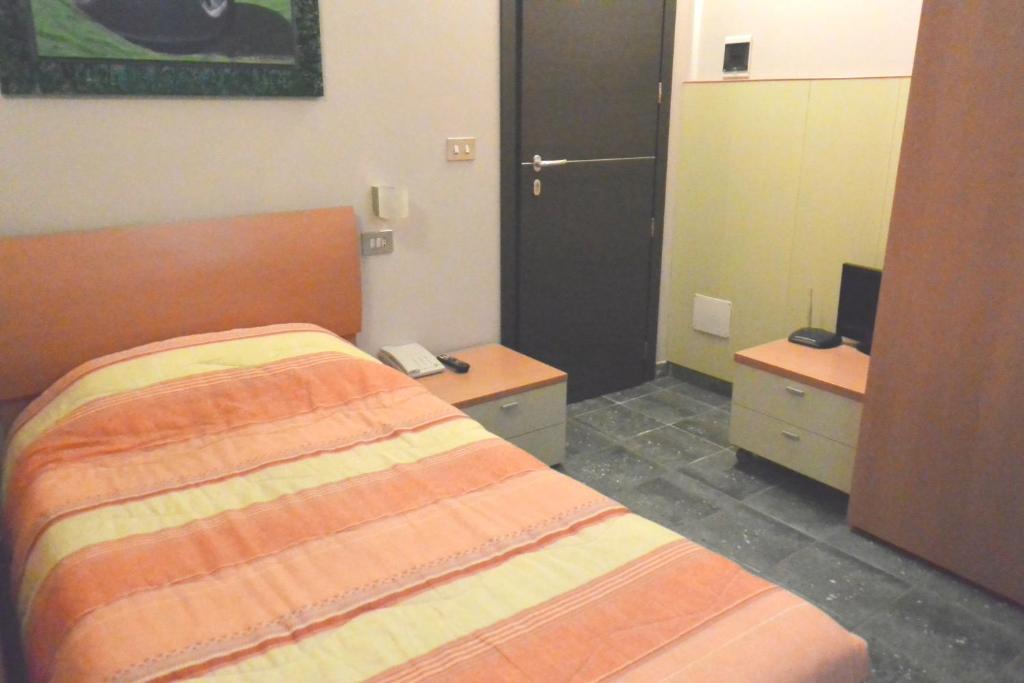 Postel nebo postele na pokoji v ubytování Hotel Balbo