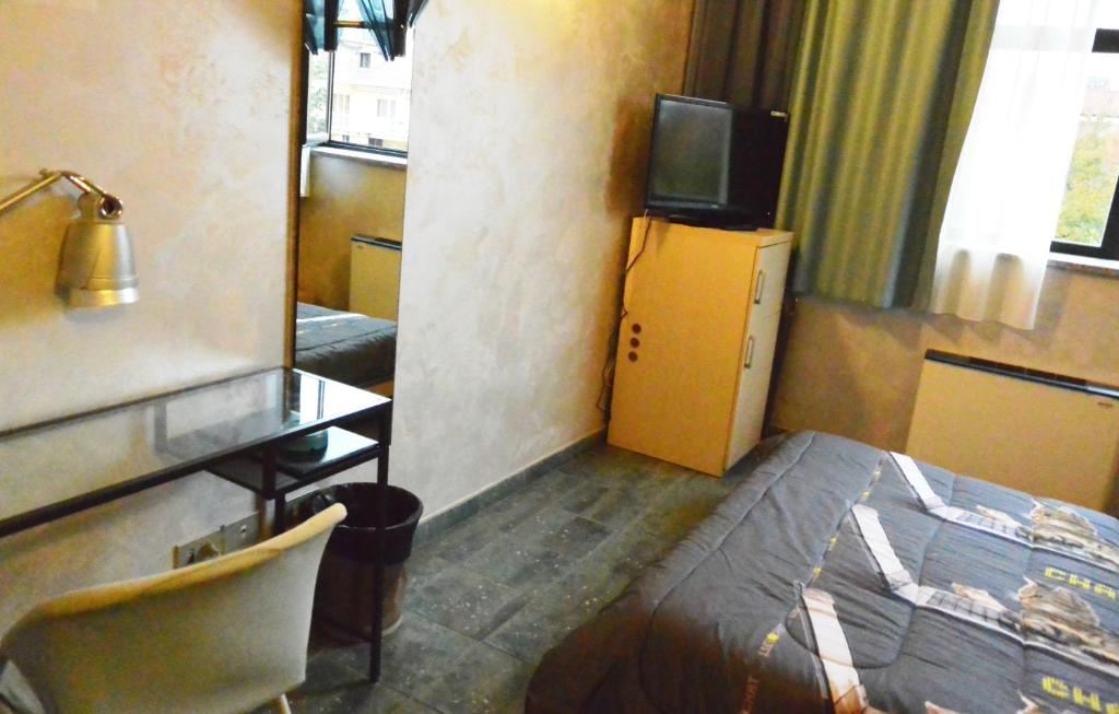 Postel nebo postele na pokoji v ubytování Hotel Balbo