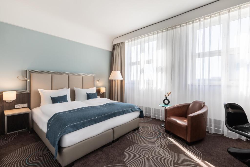 En eller flere senge i et værelse på Select Hotel Handelshof Essen