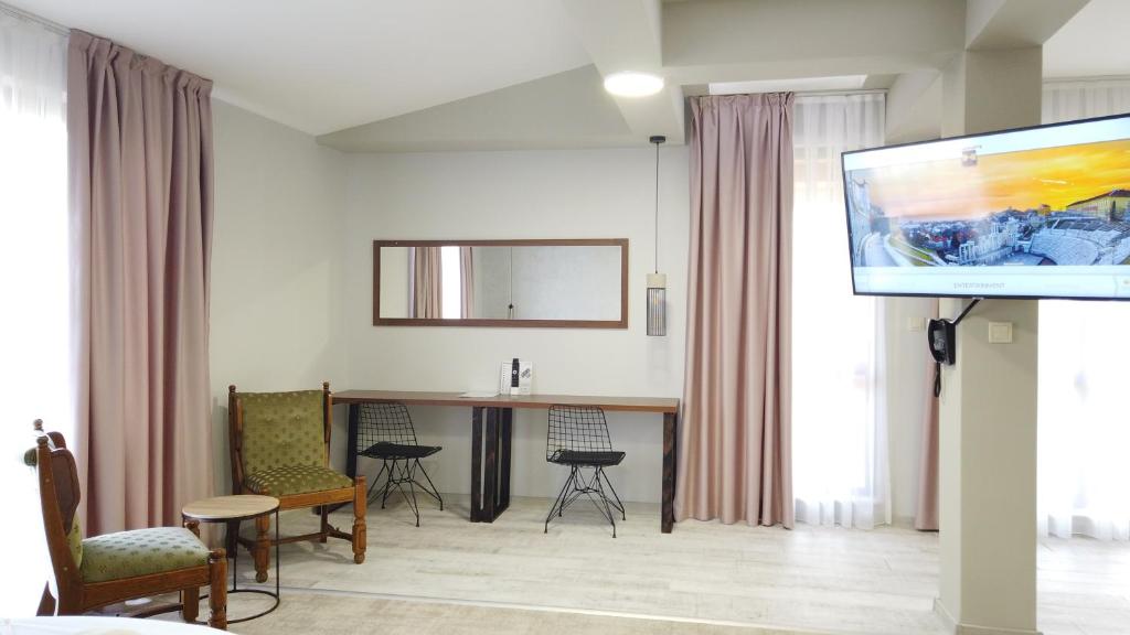 TV a/nebo společenská místnost v ubytování Clepsydra Residence