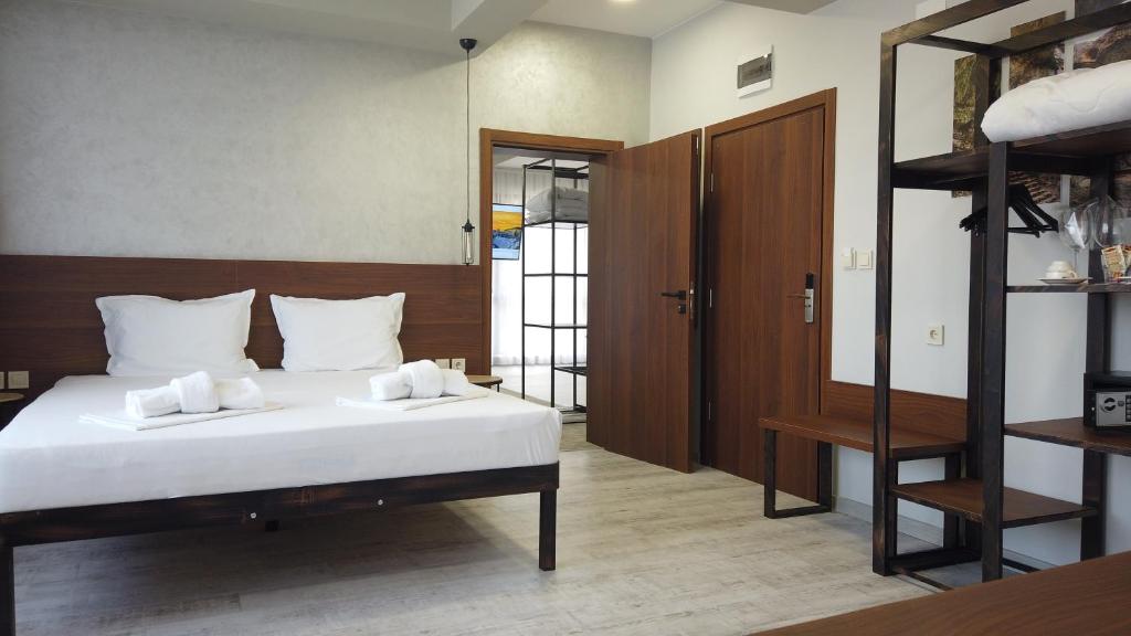 Postel nebo postele na pokoji v ubytování Clepsydra Residence