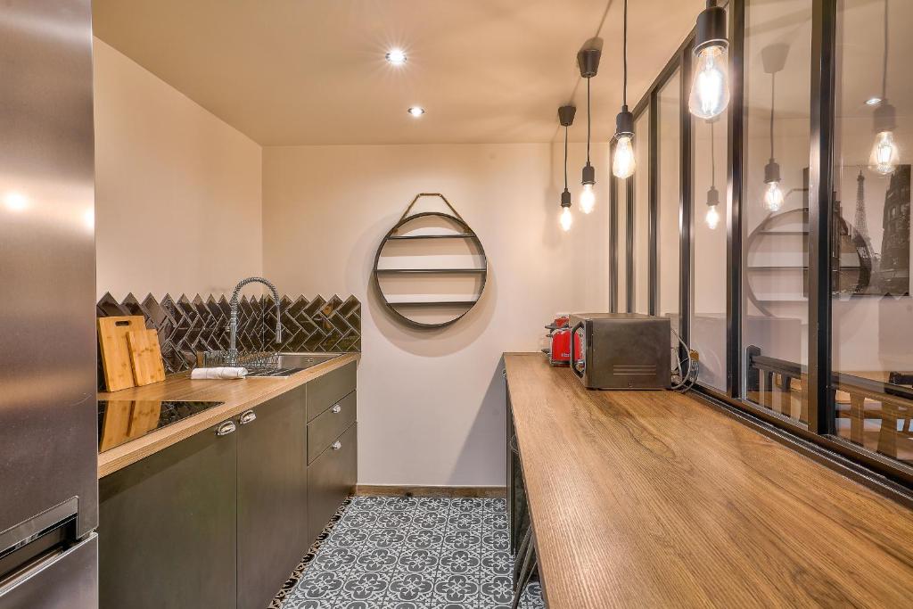 Kuchyňa alebo kuchynka v ubytovaní Bel appartement idéal pour 4 personnes, 2 chambres