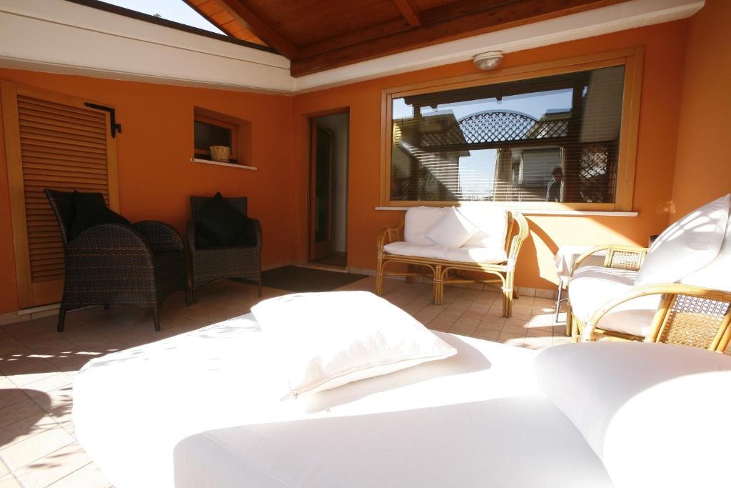 A bed or beds in a room at Villa Alba Boutique Hotel