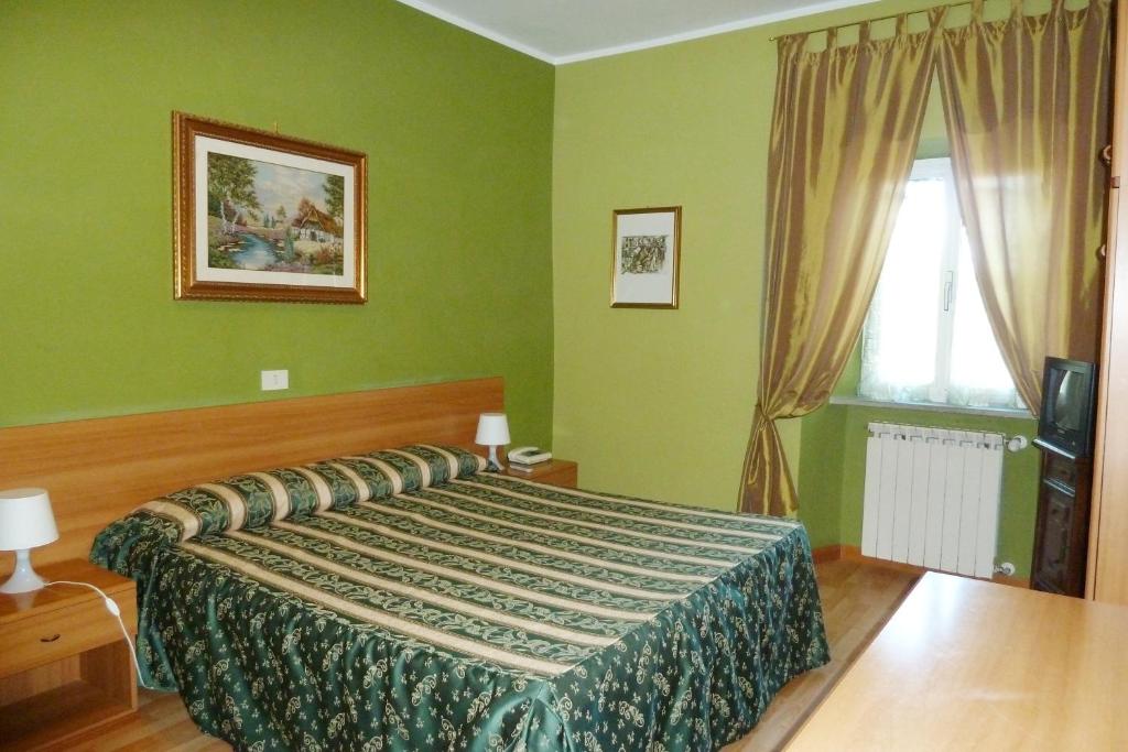 Postel nebo postele na pokoji v ubytování Hotel Sutrium