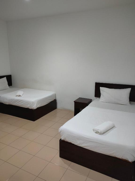 Postel nebo postele na pokoji v ubytování Hotel Star Inn