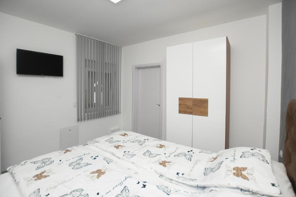 Postel nebo postele na pokoji v ubytování Relax Apartmani Kladovo