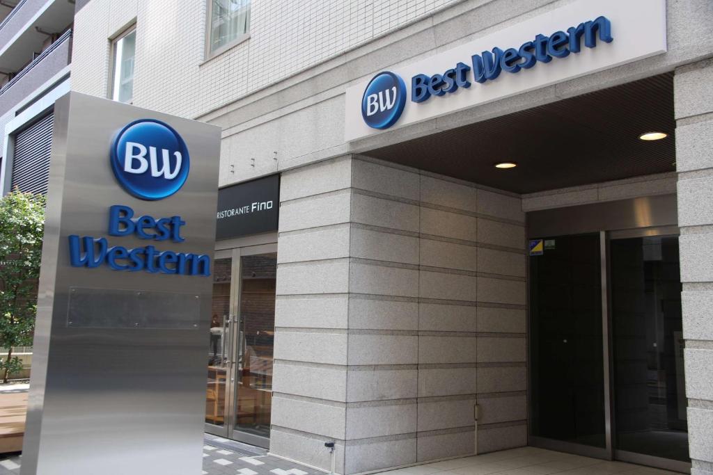 a building with a buy best western sign on it at Best Western Hotel Fino Osaka Shinsaibashi in Osaka