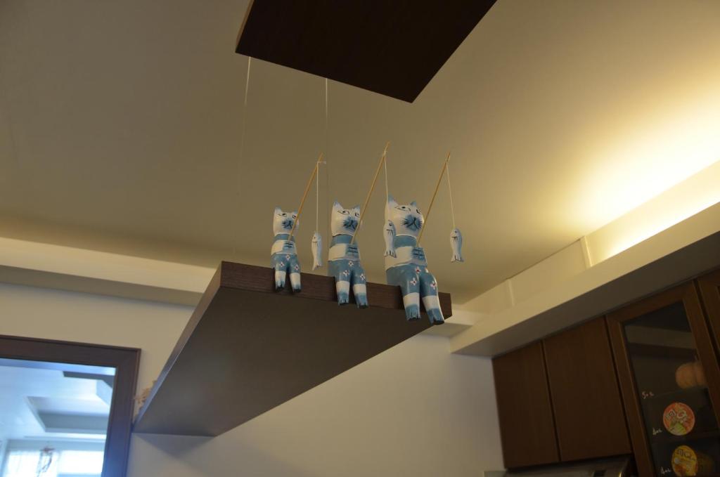 a row of four toy dogs on a shelf in a kitchen at Jia Ying Beach Resort B&amp;B in Toucheng