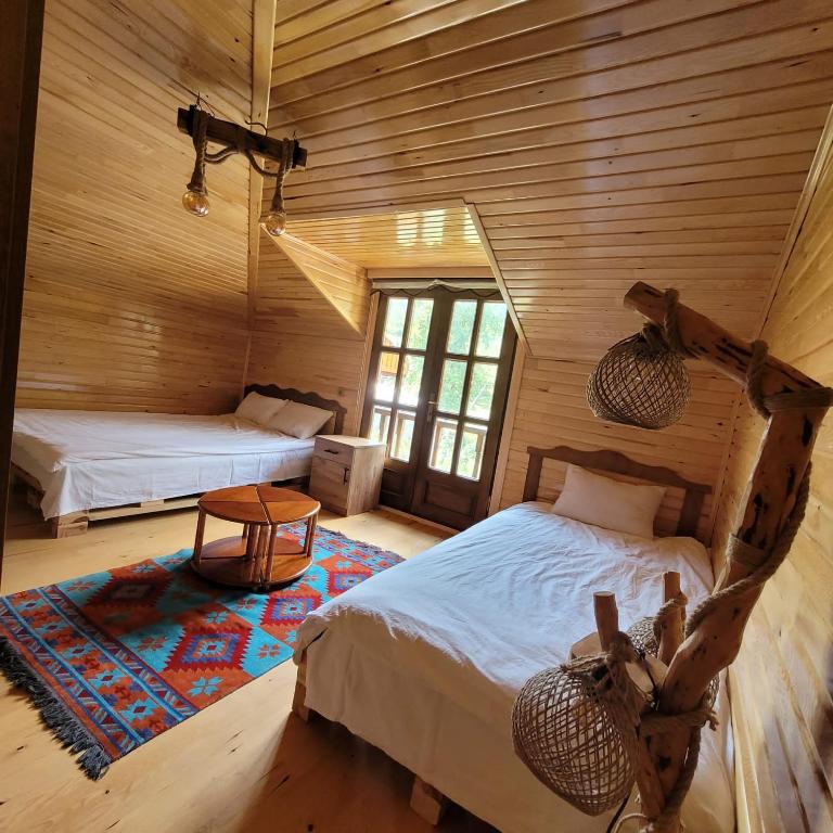 A bed or beds in a room at Selin Yaşam Evi