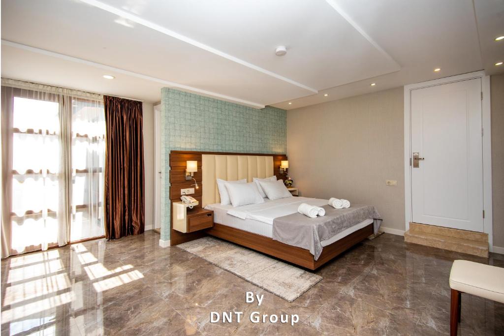 Postel nebo postele na pokoji v ubytování Margi Boutique Hotel by DNT Group