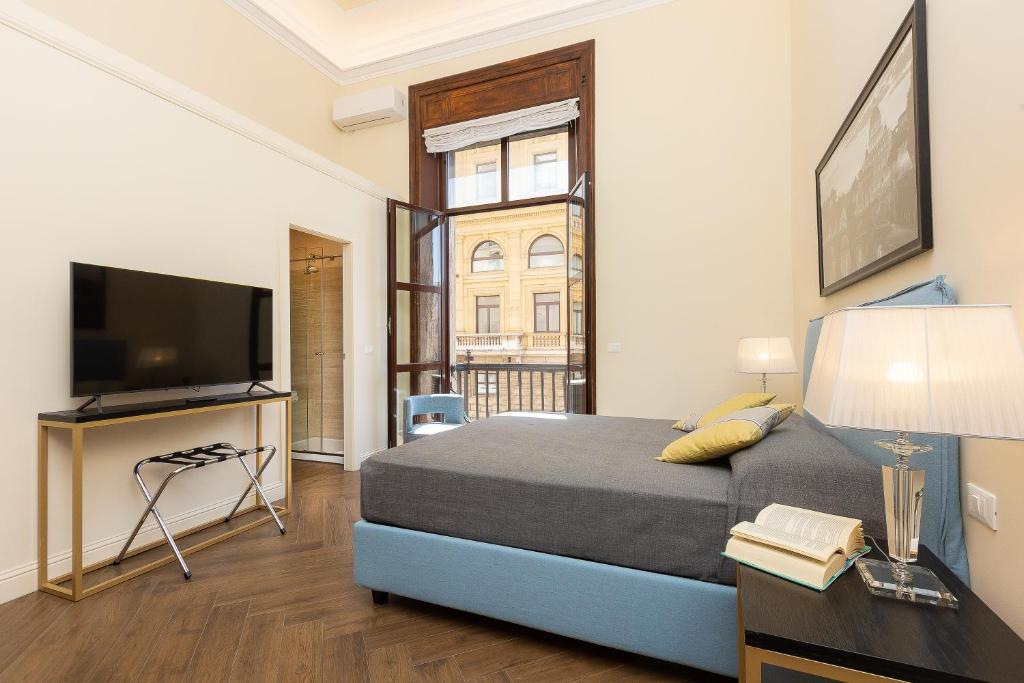 Televízia a/alebo spoločenská miestnosť v ubytovaní SPA Apartment Via Barberini