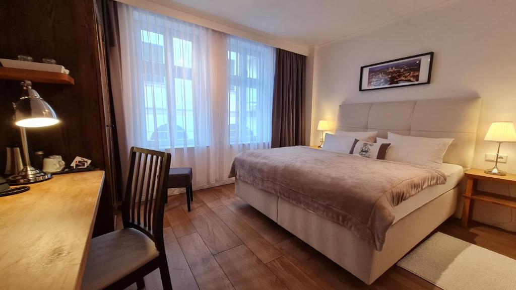 Postel nebo postele na pokoji v ubytování Hotel Domizil