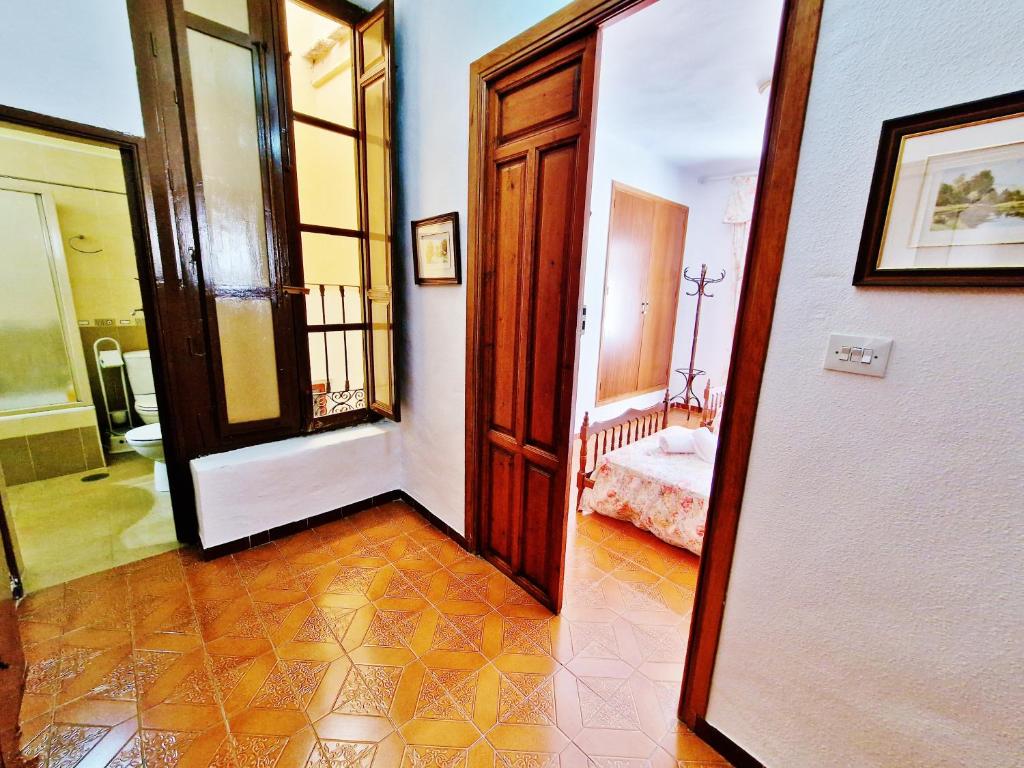 Postel nebo postele na pokoji v ubytování Velez Nazari Casa Molina