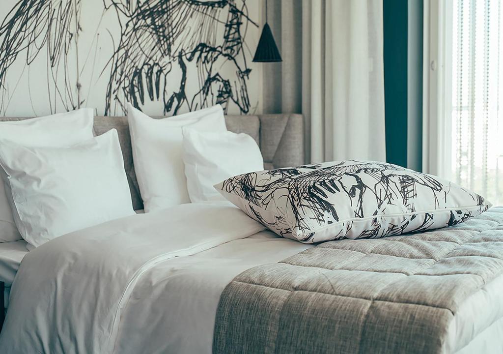 Ένα ή περισσότερα κρεβάτια σε δωμάτιο στο Hotel AX
