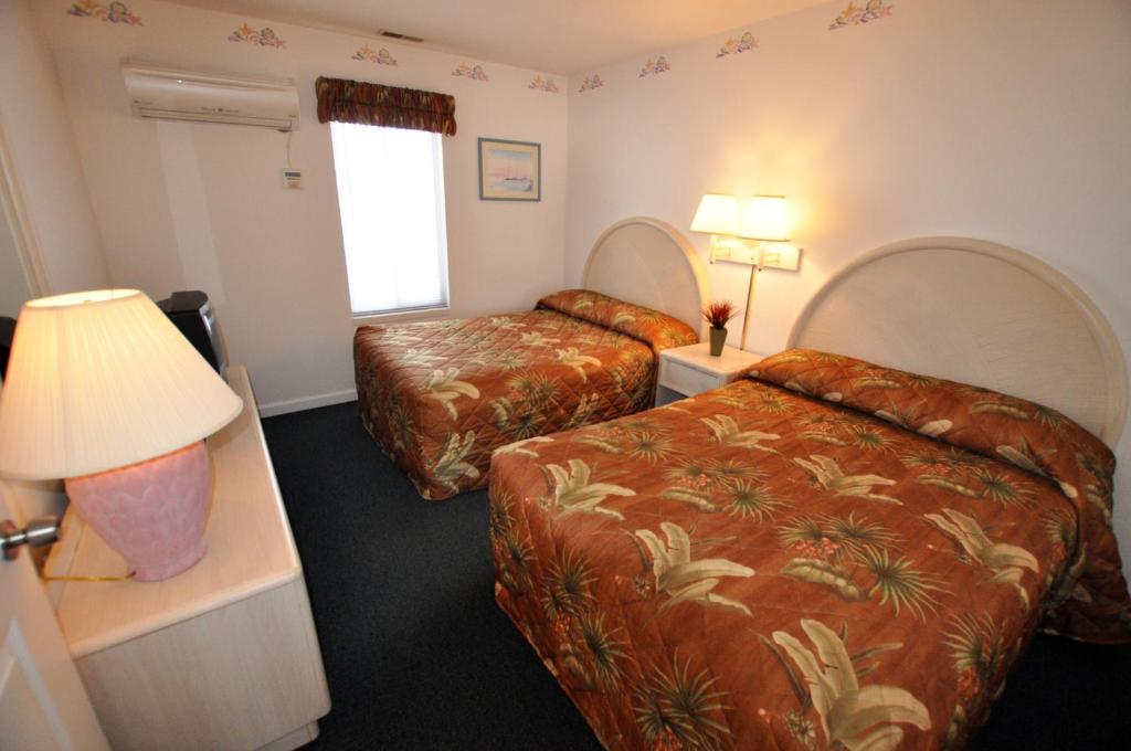Postel nebo postele na pokoji v ubytování Riviera Resort & Suites
