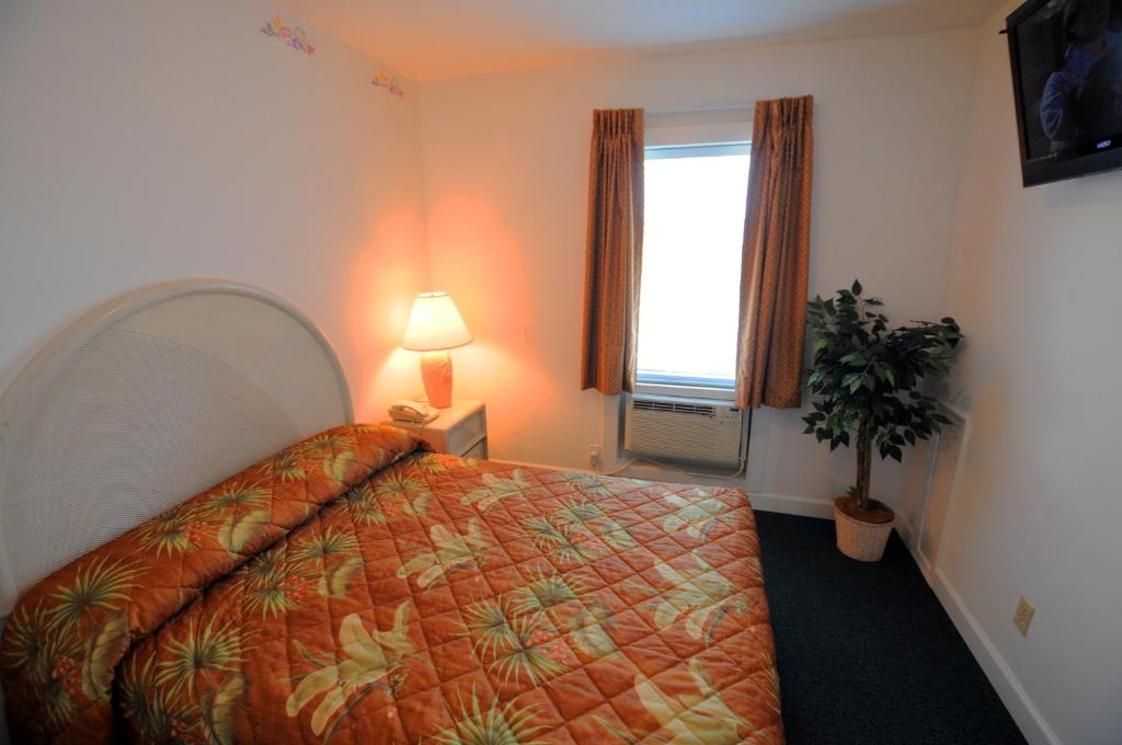 Postel nebo postele na pokoji v ubytování Riviera Resort & Suites