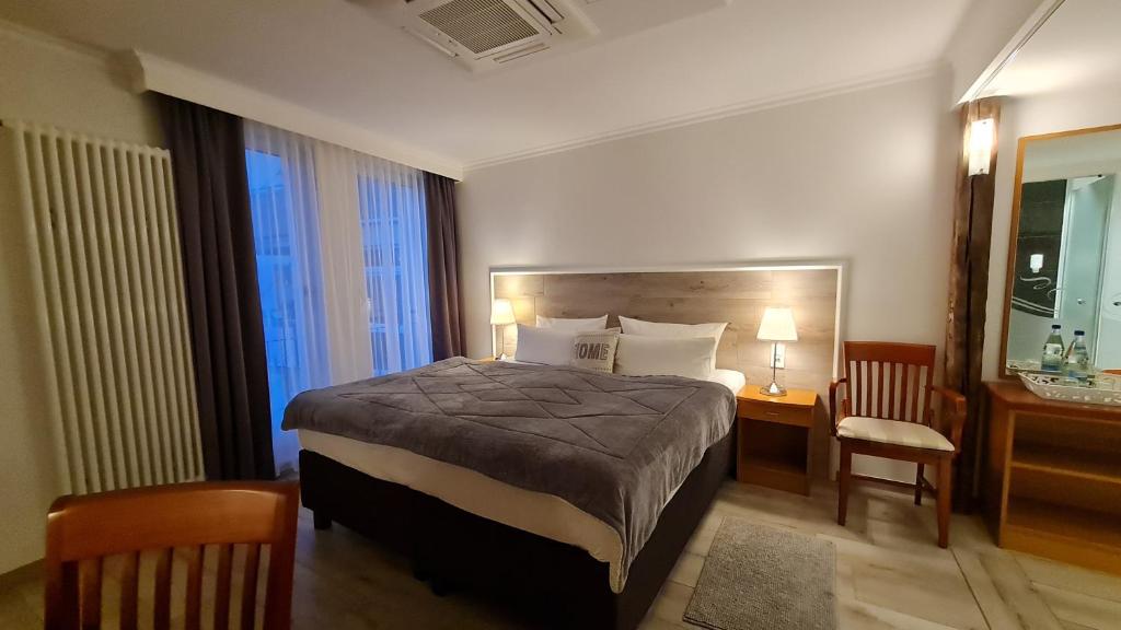 Postel nebo postele na pokoji v ubytování Hotel Domizil