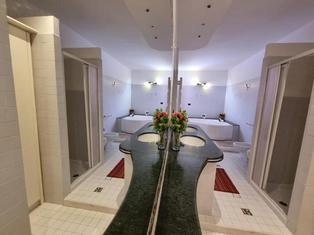 Łóżko lub łóżka w pokoju w obiekcie La MAISON B&B