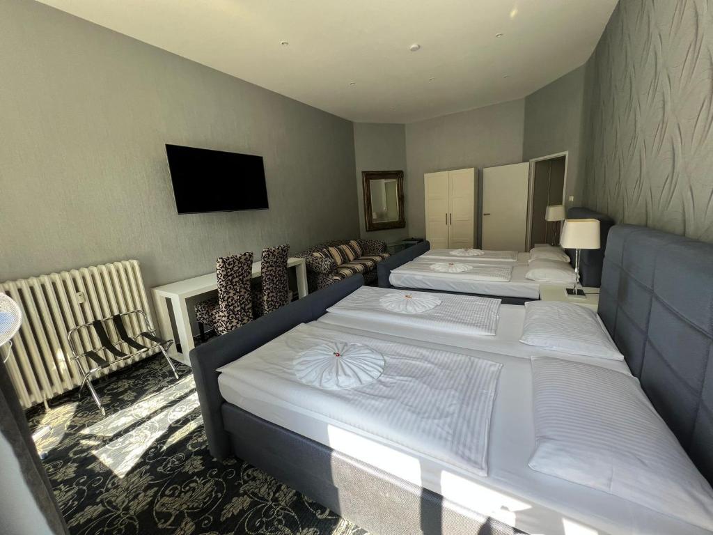 Postel nebo postele na pokoji v ubytování Hotel Gasteiner Hof