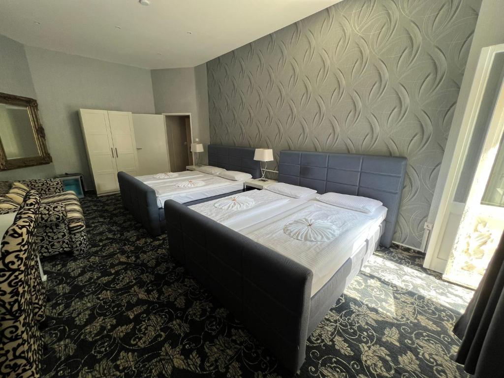 Postel nebo postele na pokoji v ubytování Hotel Gasteiner Hof