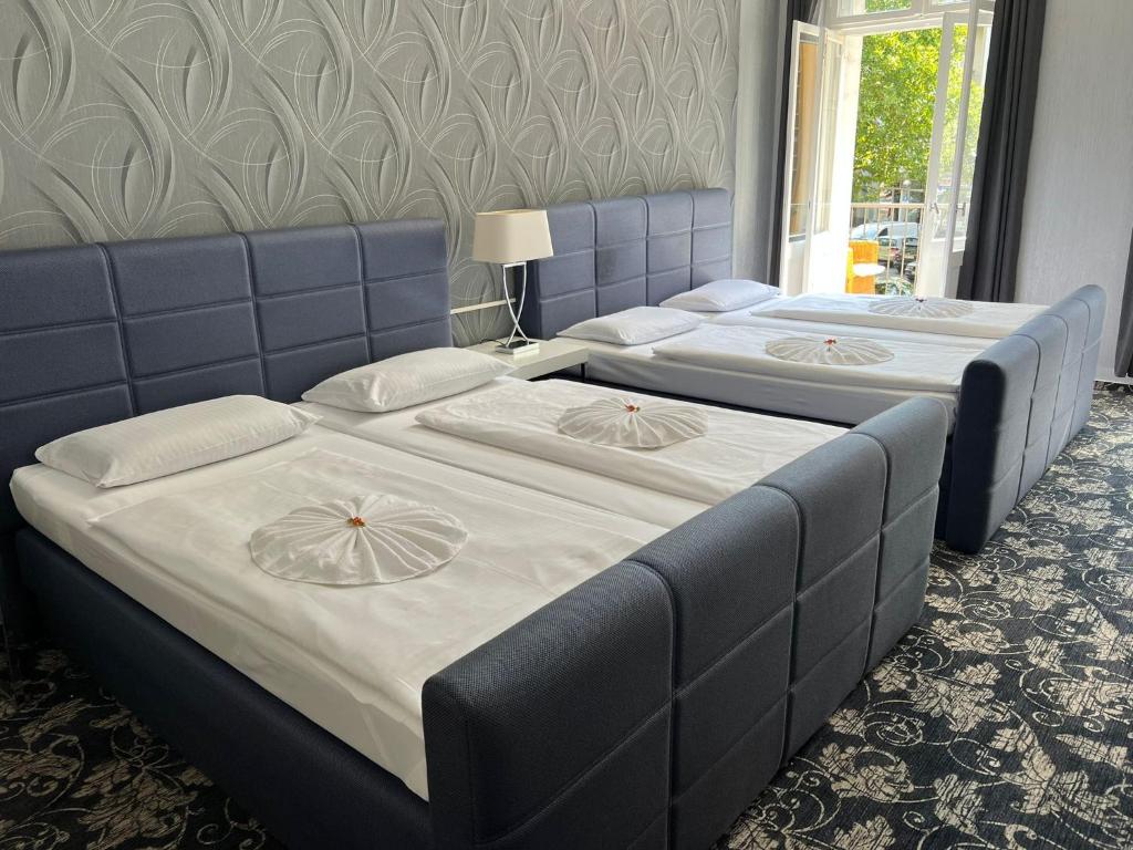 Postel nebo postele na pokoji v ubytování Hotel Gasteiner Hof