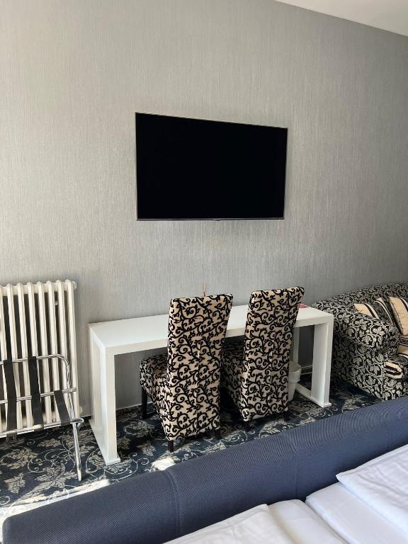 TV a/nebo společenská místnost v ubytování Hotel Gasteiner Hof