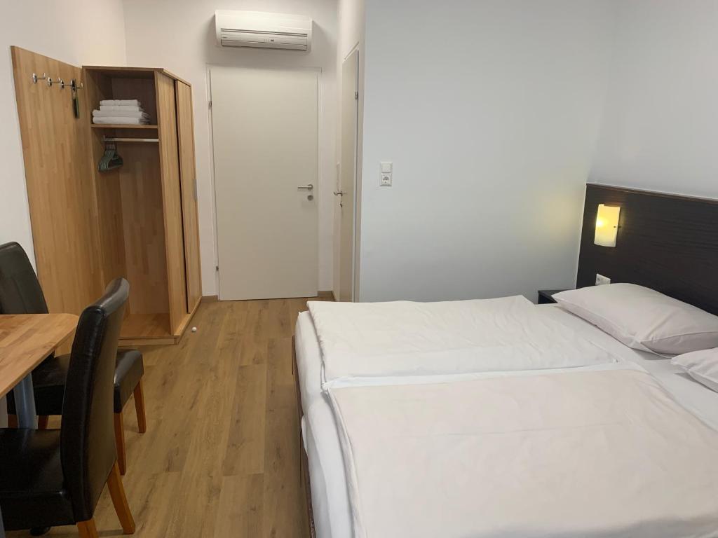 Postel nebo postele na pokoji v ubytování Apetlon`er Familie Böhm