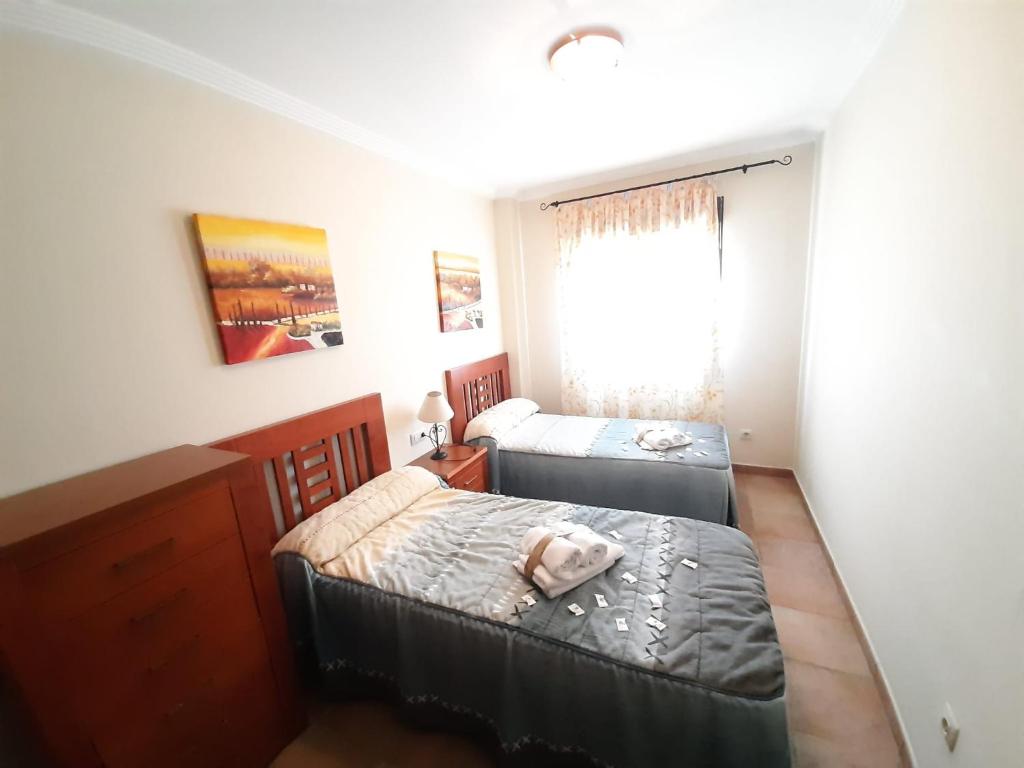 Posteľ alebo postele v izbe v ubytovaní APARTAMENTO 2 DORMITORIOS.URB PLAYA VERDE